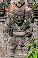 Fototapeta na wymiar Stone carving Pura Dalem Penunggekan Temple Bali Indonesia