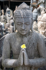 Buddhist statue at stonemasons workshop Bali Indonesia