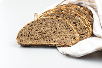 Sliced whole grain bread with oat flakes. Wholemeal bread.