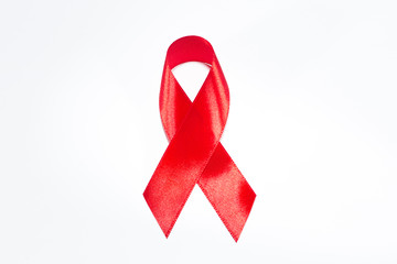 Red ribbon on a white isolated background is the symbol of World AIDS Day.