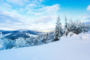 Fototapeta na wymiar New day begins in snow mountains after heavy blizzard, winter landscape