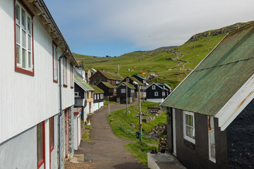 Fototapeta na wymiar Beautiful village of Mykines with colorful houses with grass on the roofs, Mykines island, Faroe Islands, Europe.