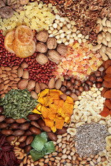 Dried fruit, seed and nut selection, health food high in antioxidants, protein, minerals, vitamins, omega 3 and anthocyanins. Flat lay.