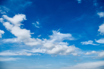 Naklejka na ściany i meble Blue sky background with white clouds. Blue sky and clouds. Beautiful cloud scape over horizon.