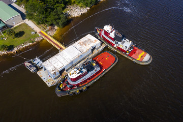 Fototapeta na wymiar Tug boats docket at their station in Jacksonville, FL.