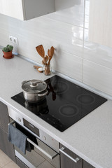 Kitchen with built in ceramic induction stove
