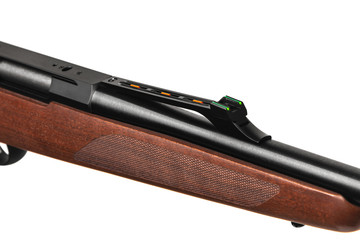 Modern bolt carbine isolated on white background. Close-up of a weapon with a wooden butt for...