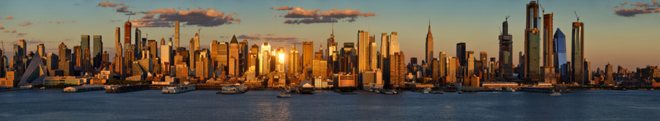 Panoramic New York City sunset on Midtown West, its skyscrapers and the Hudson Yards. View on...