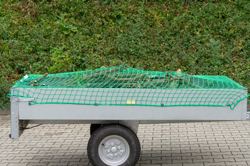 Car trailer with net for load securing