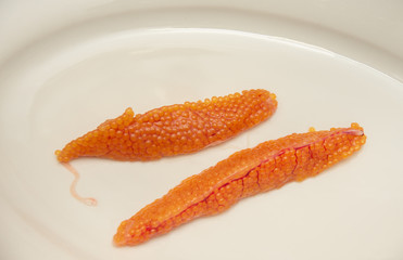 Orange caviar rye from trout fish   on a plate 