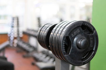 Barbell in Gym (sports inventory) with beautiful bokeh on bottom