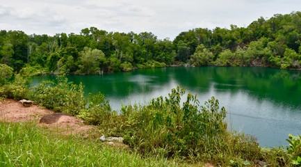 Fototapeta na wymiar Lake in old quarry on Pulau Ubin an island of Singapore