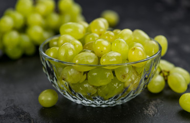 Portion of healthy White Grapes (selective focus; close-up shot)