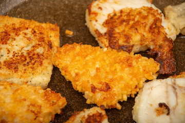 fish with egg and potatoes in the tray