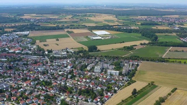 Aerial view of the city Alsbach in Germany. On a sunny day in Summer. Pan to the left beside the city.