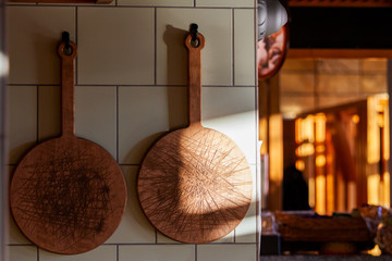 meat cutting boards hang in the kitchen