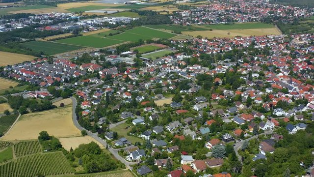 Aerial view of the city Alsbach in Germany. On a sunny day in Summer. Pan to the left around the city.