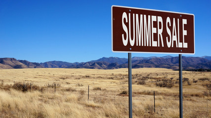 Summer sale word on road sign