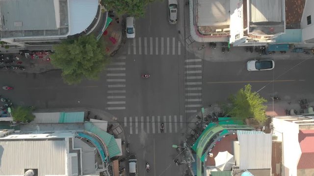 a flying camera flies over the roofs of Vietnamese slums and houses, overlooking the road and predizayuschie cars, different angles, view from top to bottom.