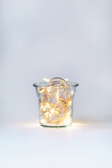 Christmas garland in a glass vase, New Year decor