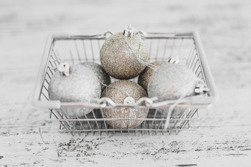 festive shopping and decorations, Christmas baubles in shopping basket with gold and silvery tones