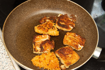 fish with egg and potatoes in the tray