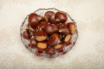 A small pile of chestnuts, conkers isolated 
