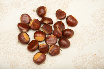A small pile of chestnuts, conkers isolated 