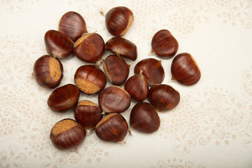 A small pile of chestnuts, conkers isolated 