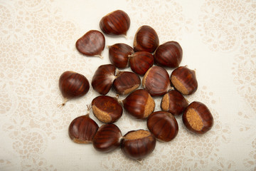 A small pile of chestnuts, conkers isolated 