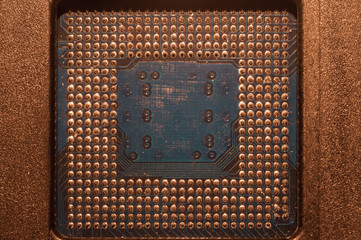 Processor pins macro. computer motherboard close up. cpu pins on a circuit board. computer central...