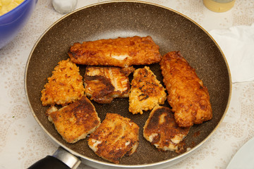 fish with egg and potatoes in the tray