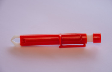 red Extractor for removing ticks,TICK TWISTER in a hand