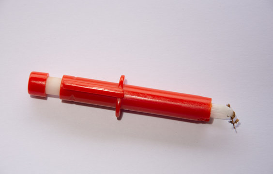 Red  Extractor for removing ticks,TICK TWISTER in a hand