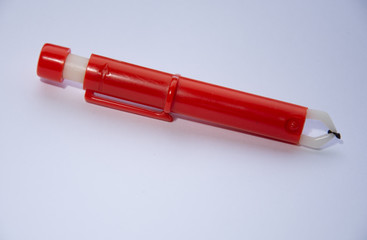 red Extractor for removing ticks,TICK TWISTER in a hand