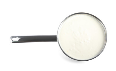 Fototapeta na wymiar Delicious creamy sauce in pan on white background, top view