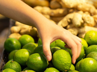 Teen girls shopping in supermarket reading product information. Choosing daily product.Concept of healthy food, bio, vegetarian, diet.