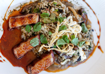 Risotto de cogumelos vegan dish, closeup. Italian