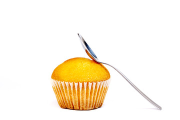 MUFFIN WITH SPOON ON WHITE BACKGROUND