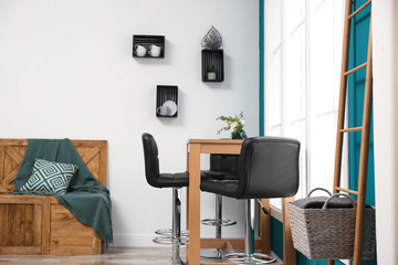 Elegant room interior with wooden table and bar chairs