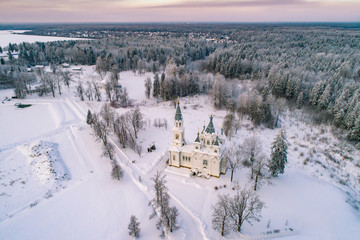 Saint Petersburg. Russia. Leningrad region. View from the height of the Church and trees. Winter in Russia. Russian churches. Orthodoxy. Religious building. Winter landscape.