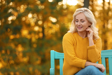 Portrait of happy mature woman in park