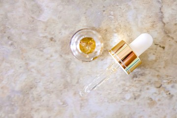 Pipette and bottle of serum.
