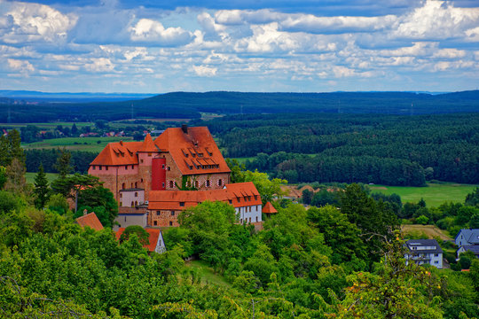Beautiful sky with clouds over the ancient castle Burg Wernfels