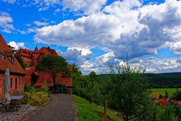 Beautiful sky with clouds over the ancient castle Burg Wernfels