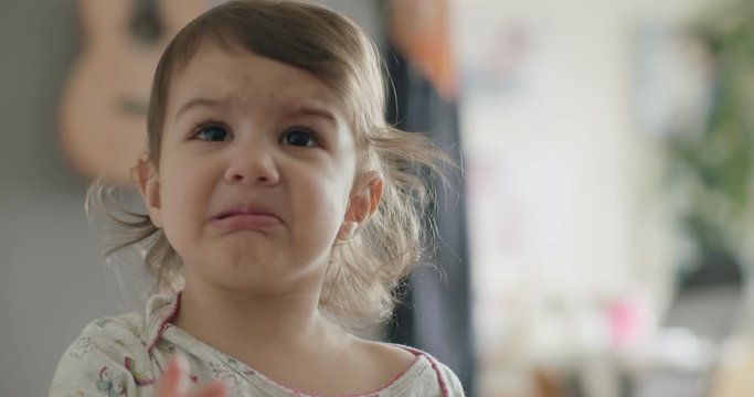 Portrait of little sobbing toddler girl. Shot in 4K RAW on a cinema camera.