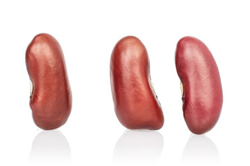 Group of three whole fresh red kidney beans isolated on white background