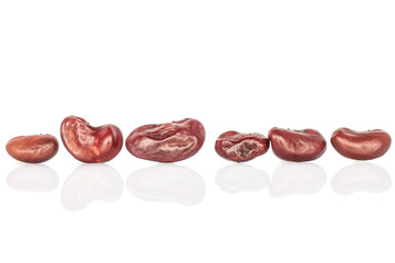 Group of six whole fresh red kidney beans isolated on white background