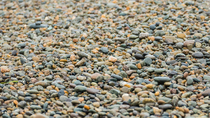 Obraz premium Sea surf stones and pebbles