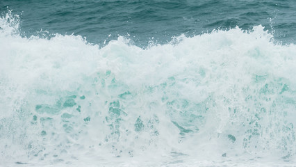 Sea surf blue waves and white foam